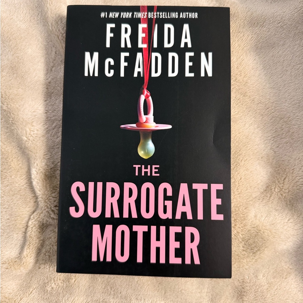 The Surrogate Mother by Freida McFadden - Black & Pink Paperback